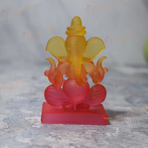 Car Ganesha Showpiece in Unheroic and Orange Double-Sided Crystal