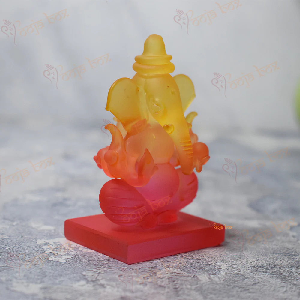 Car Ganesha Showpiece in Unheroic and Orange Double-Sided Crystal
